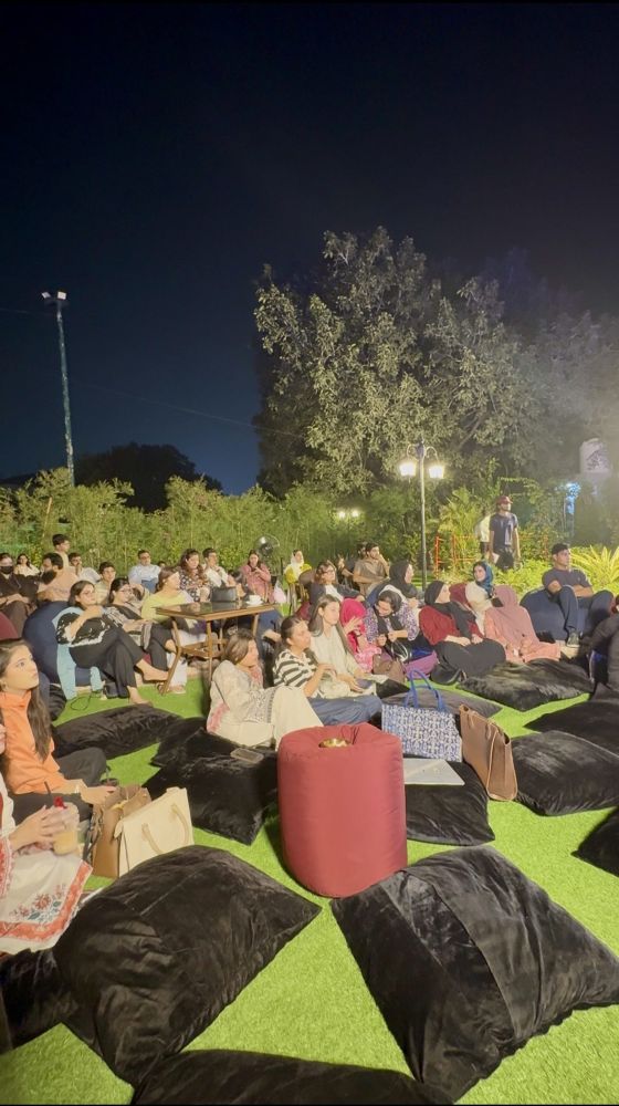 Cushions on the lawn, the whole garden listening.