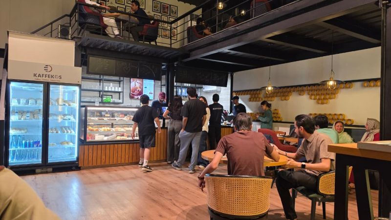 Inside Kaffekos, the counter and the mezzanine.