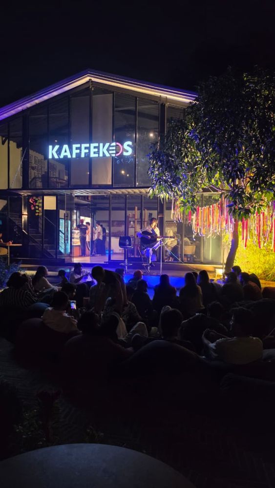 The Kaffekos sign glowing, the garden full and the music on.