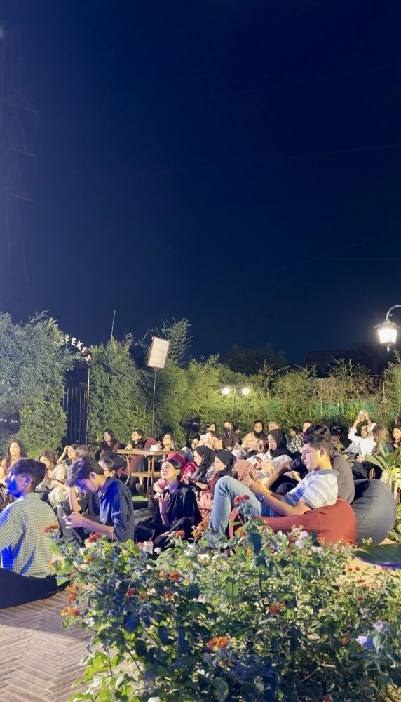 Under the night sky, all ears on the music.