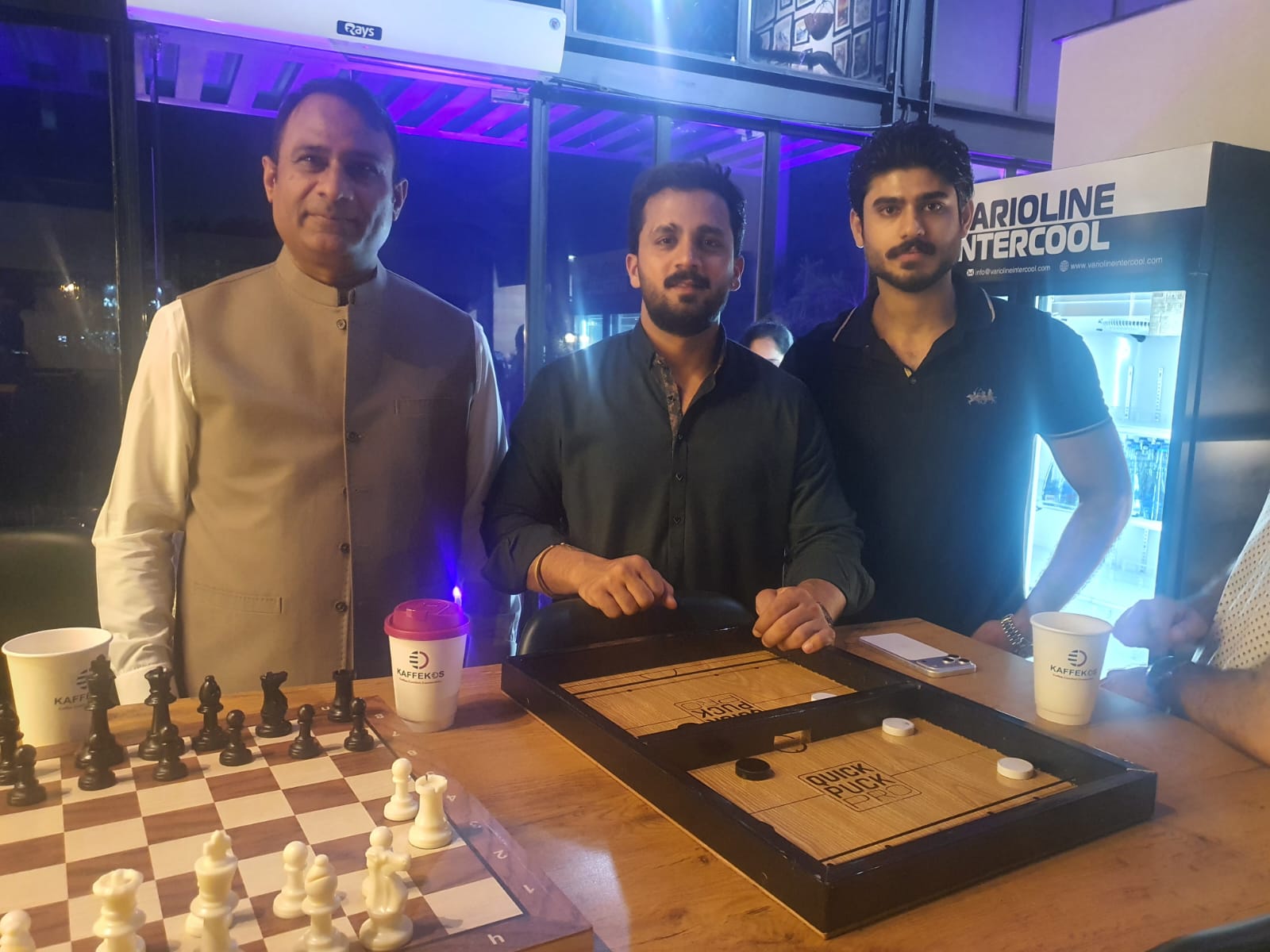 Guests with chess and Quick Puck on opening day